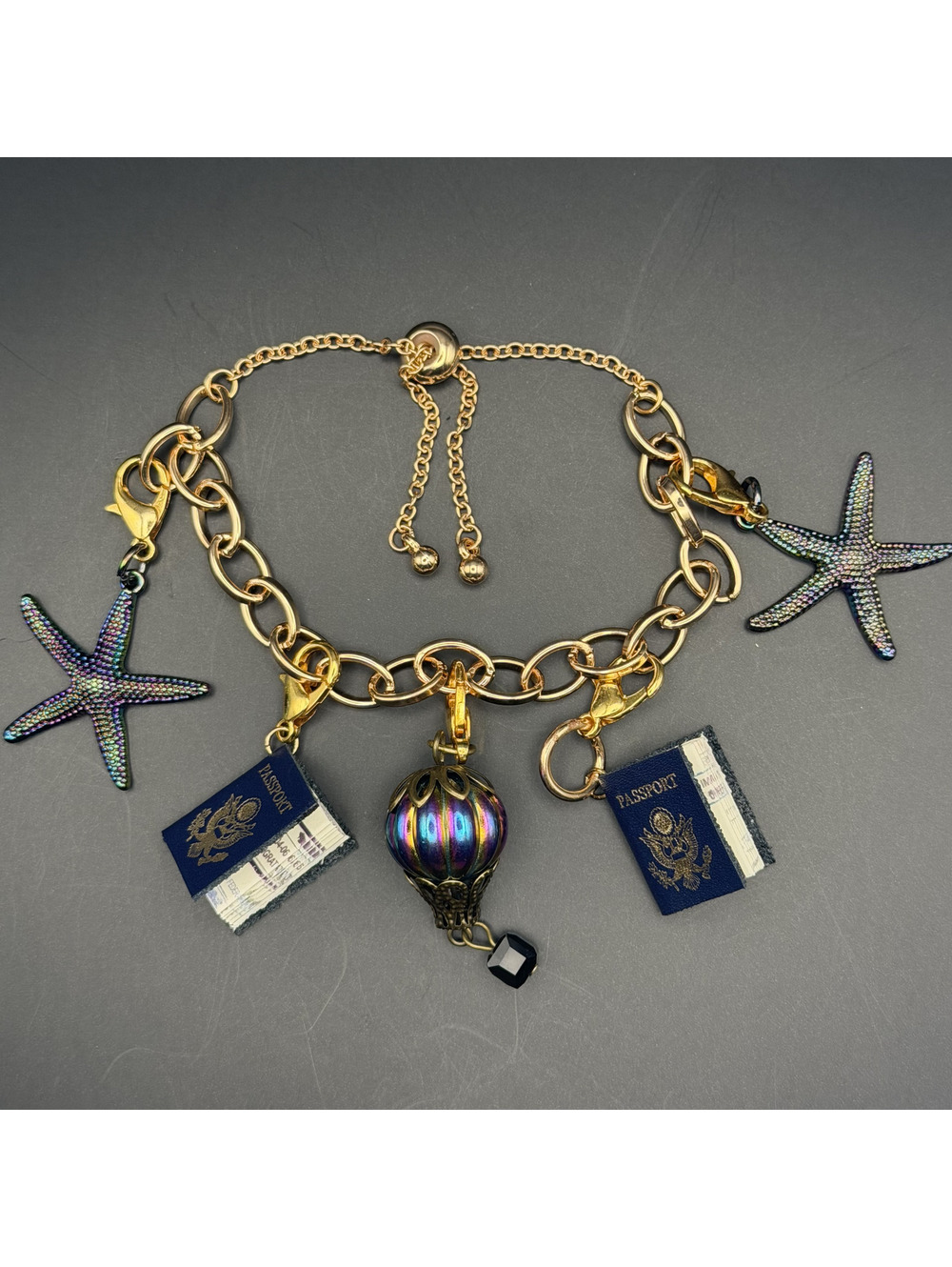 Gold Tone Travel Charm Bolo Bracelet Hot Air Balloon Starfish Passport Charms